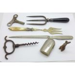 A 19th Century corkscrew, clock key, combination letter opener/pocket knife, a Coty scent bottle