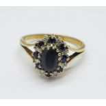 A 9ct gold, sapphire and diamond cluster ring, 2.5g, O