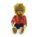 A small early 20th Century novelty tin-plate felt covered monkey figure, 6cm