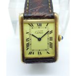 A silver gilt cased must de Cartier Tank Quartz wristwatch, 21mm case