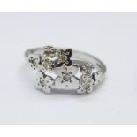 An 18ct white gold and diamond floral ring, 3.7g, L