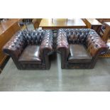 A pair of brown leather Chesterfield club chairs