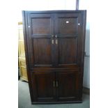 A George III oak freestanding corner cupboard