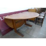 A Danish G.P. Farum teak circular drop-leaf dining table