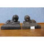 A pair of small Victorian cast iron figures of recumbent lions