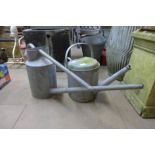 Two galvanised watering cans