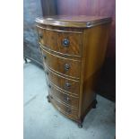 A small walnut bow front chest of drawers