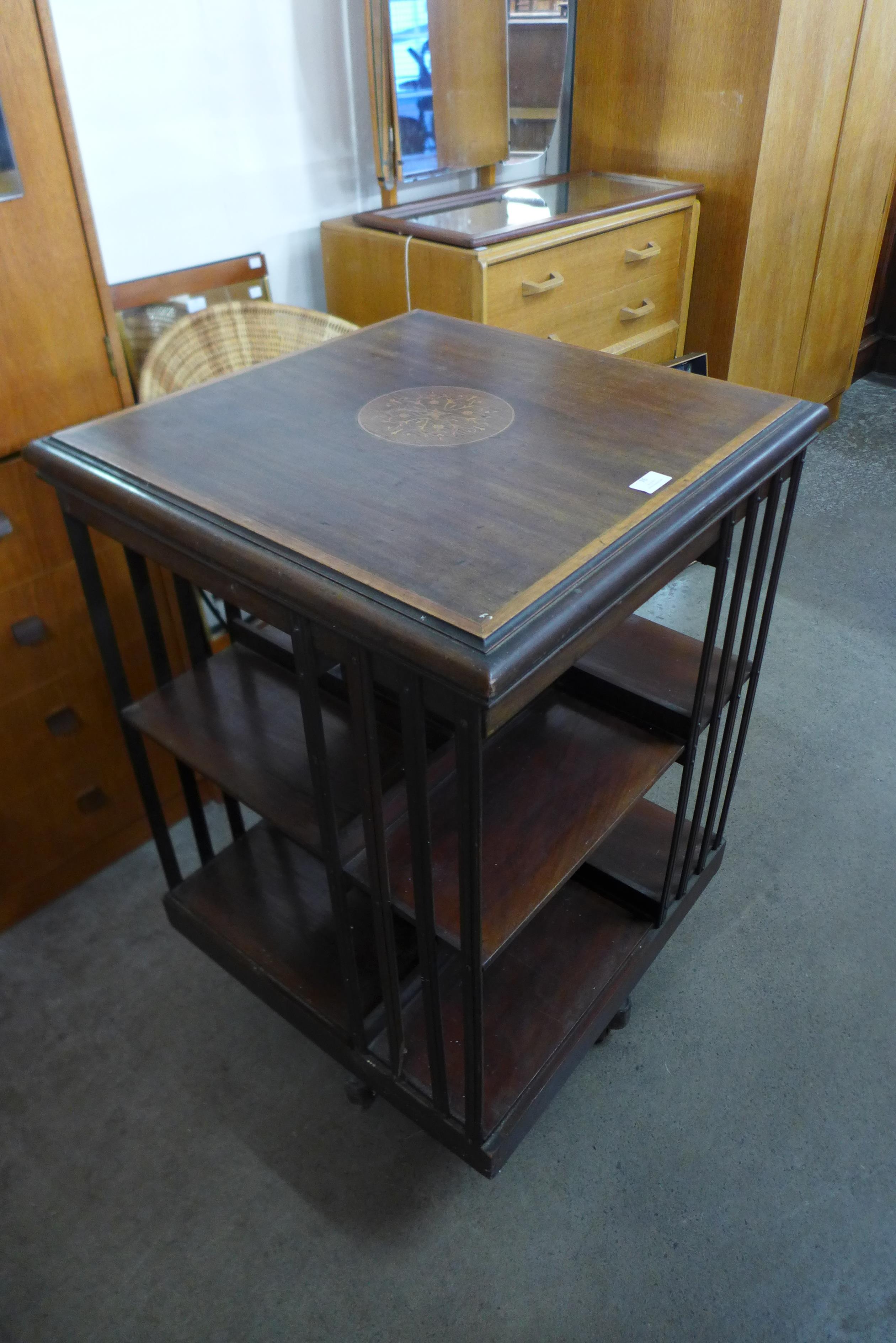 An Edward VII inlaid mahogany revolving bookcase, 89cms h