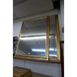 A pair of bevelled rectangular gilt framed mirrors, 114 x 87cms