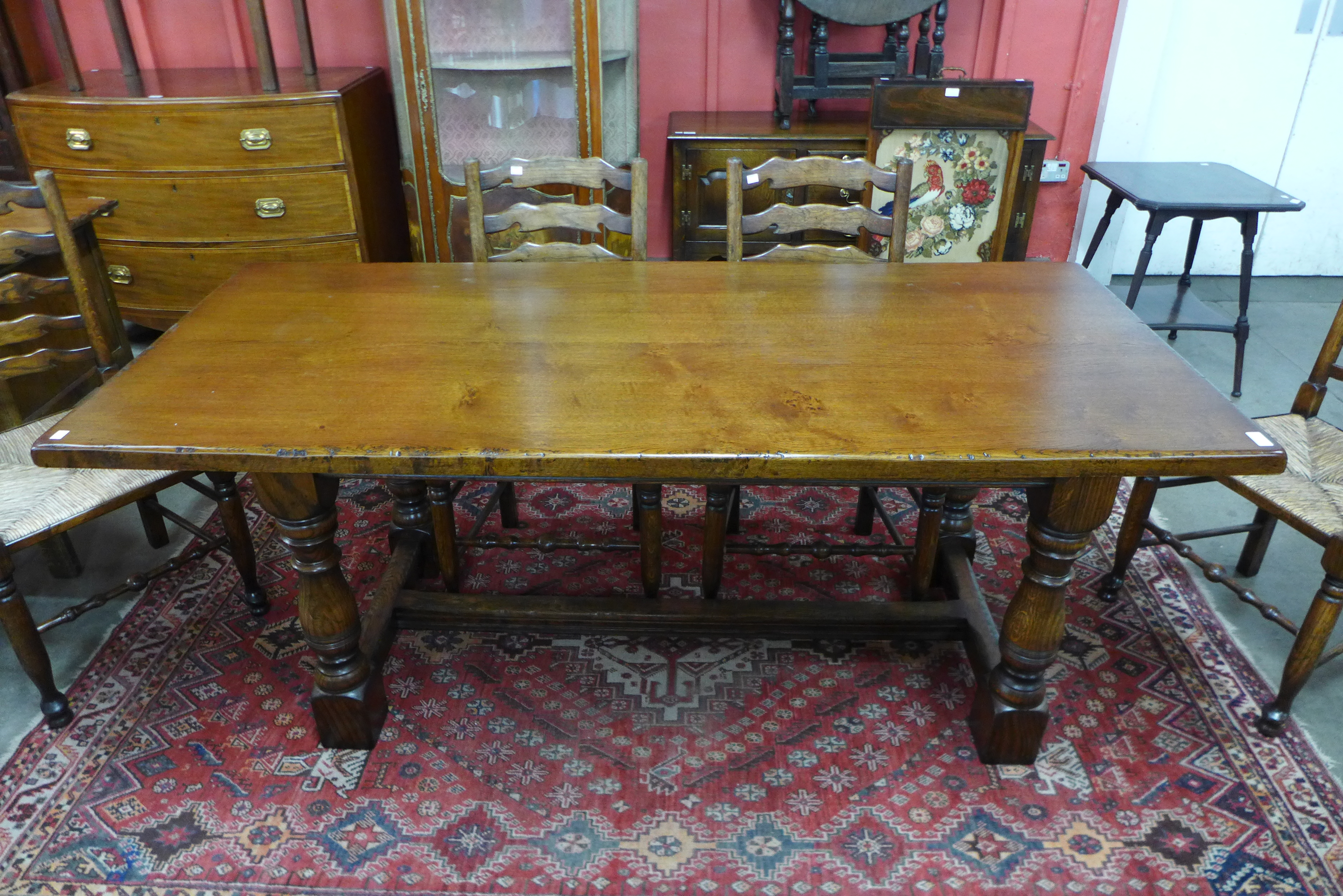 A 17th Century style oak refectory table (74cm h, 183 cms l, 81 cms w) and six oak ladderback rush - Image 4 of 4