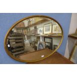 A Regency gilt framed oval mirror