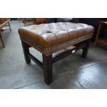 A mahogany and brown leather Chesterfield footstool