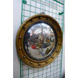 A Regency style gilt framed convex mirror