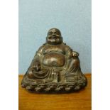 An oriental bronzed figure of seated Buddha, 33cms h