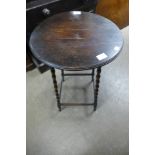 An oak bobbin turned circular occasional table