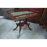 A Regency style mahogany and green leather topped silver table