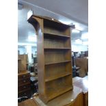 An Arts and Crafts oak open bookcase