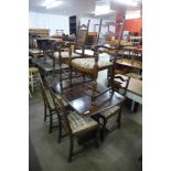 An elm refectory table and six dining chairs