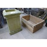 A concrete chimney pot and a wooden advertising crate