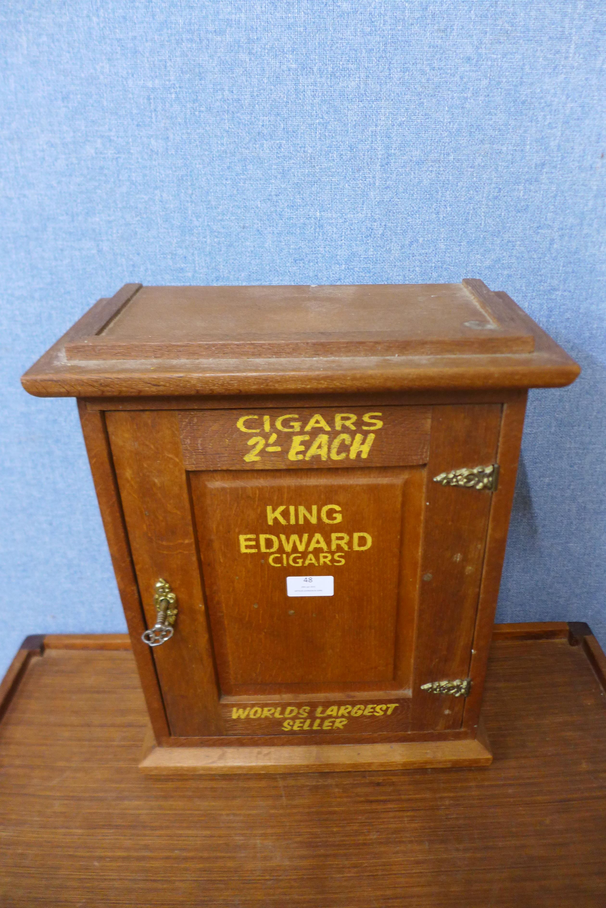 An Edward VII oak wall mounted cabinet, bearing King Edward Cigars bearing inscription