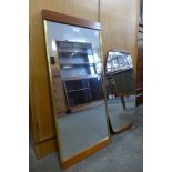 Two teak framed mirrors