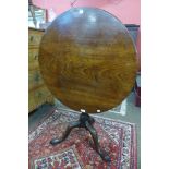 A George III mahogany circular tilt-top tea table