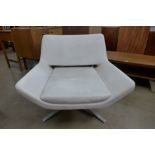 A B&B Italia cream leather and chrome Metropolitan swivel chair, designed by Jeffrey Bernett