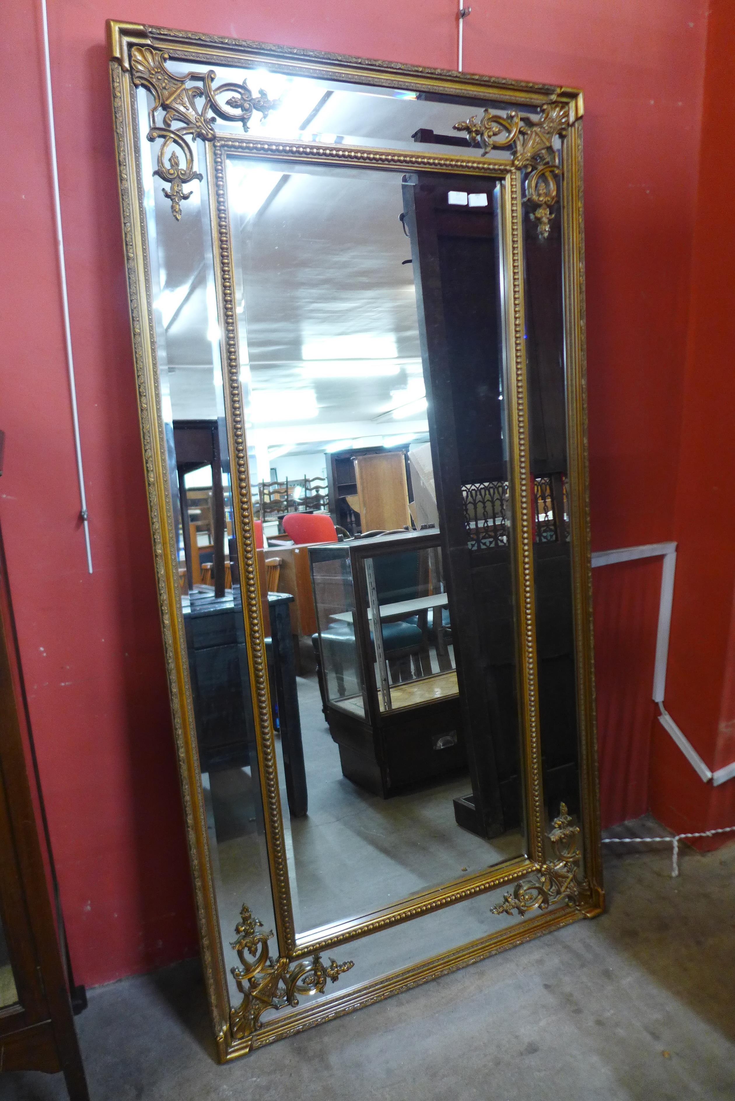 A large gilt French style framed mirror, 184 x 93cms (M33138) #