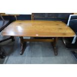 An Ercol Golden Dawn elm refectory table