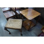 A walnut occasional table and a stool