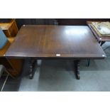 An oak draw-leaf refectory table