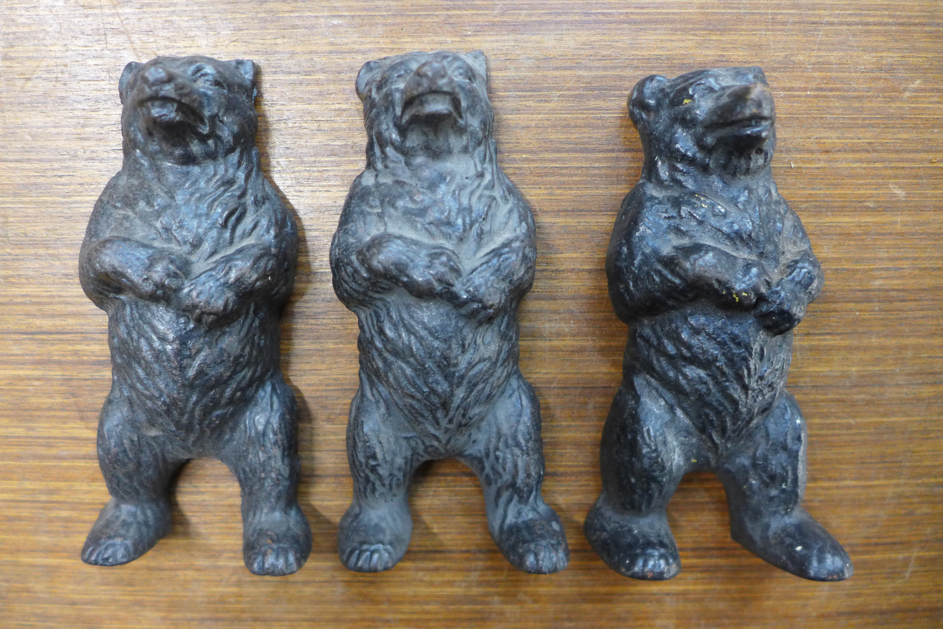 Three small Victorian cast iron figures of bears