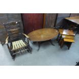 An elm rocking chair, a mahogany coffee table and an oak nest of tables