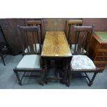 An oak barleytwist gateleg table and four chairs