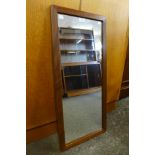 A teak framed mirror