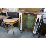 A walnut display cabinet and a burr walnut demi-lune hall table