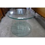 A Green Apple glass circular coffee table