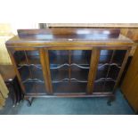 An Edward VII Waring & Gillows mahogany three door bookcase