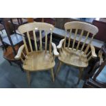 A pair of beech elbow chairs