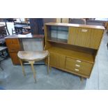 A simulated teak highboard, a walnut demi-lune table and a display cabinet