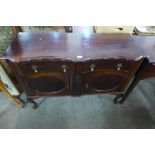 A mahogany serpentine sideboard and a mahogany two drawer side table