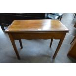 A George III mahogany rectangular fold over tea table