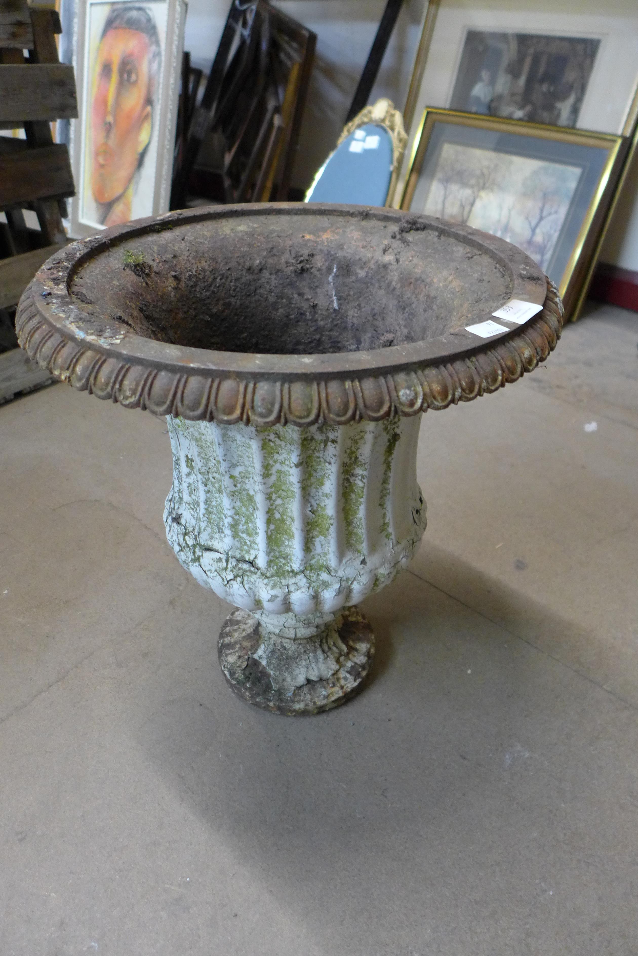 A Victorian cast iron campana shaped garden urn