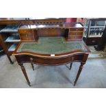A French style mahogany and green leather topped bonheur de jour