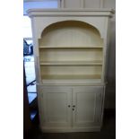 A white painted bookcase