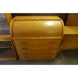 A teak cylinder bureau