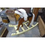 A painted pine rocking horse