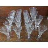 A collection of slice cut wine glasses including three part sets