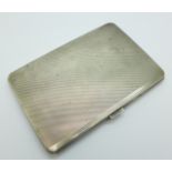 A silver cigarette case, Goldsmiths & Silversmiths, 206g, 12.5cm x 8.5cm