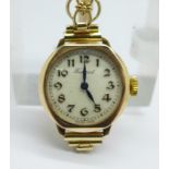 A lady's 1930's 9ct gold cased Federal wristwatch on a rolled gold bracelet, with original paperwork